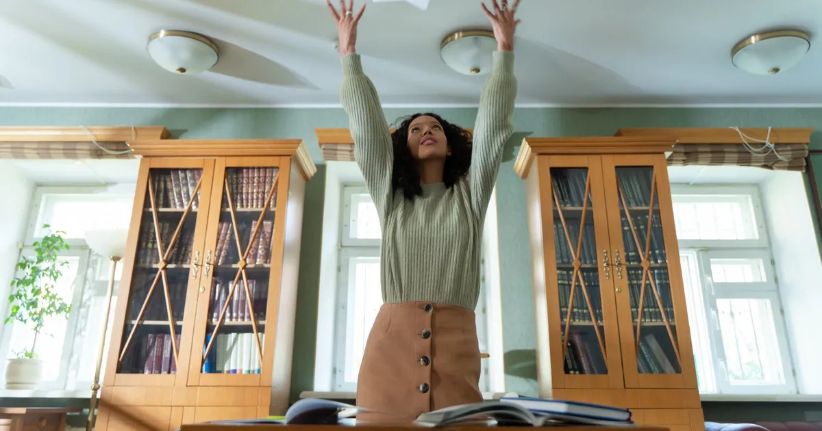 Relieved Canadian reading debt forgiveness documents at a kitchen table after a consumer proposal is accepted