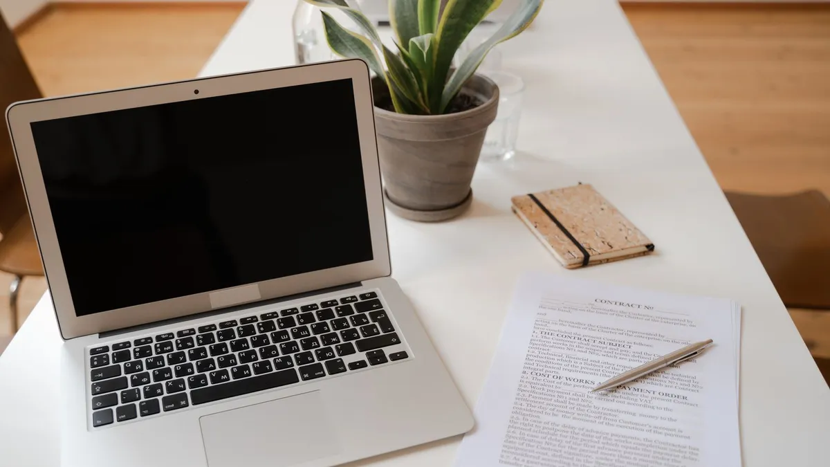 Calm home setting with debt statements and a monthly budget organized on a table before a trustee consultation